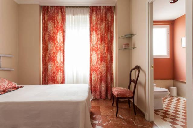 Postel nebo postele na pokoji v ubytování Apartamento Plaza Nueva