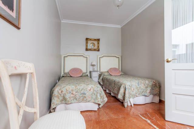 Postel nebo postele na pokoji v ubytování Apartamento Plaza Nueva