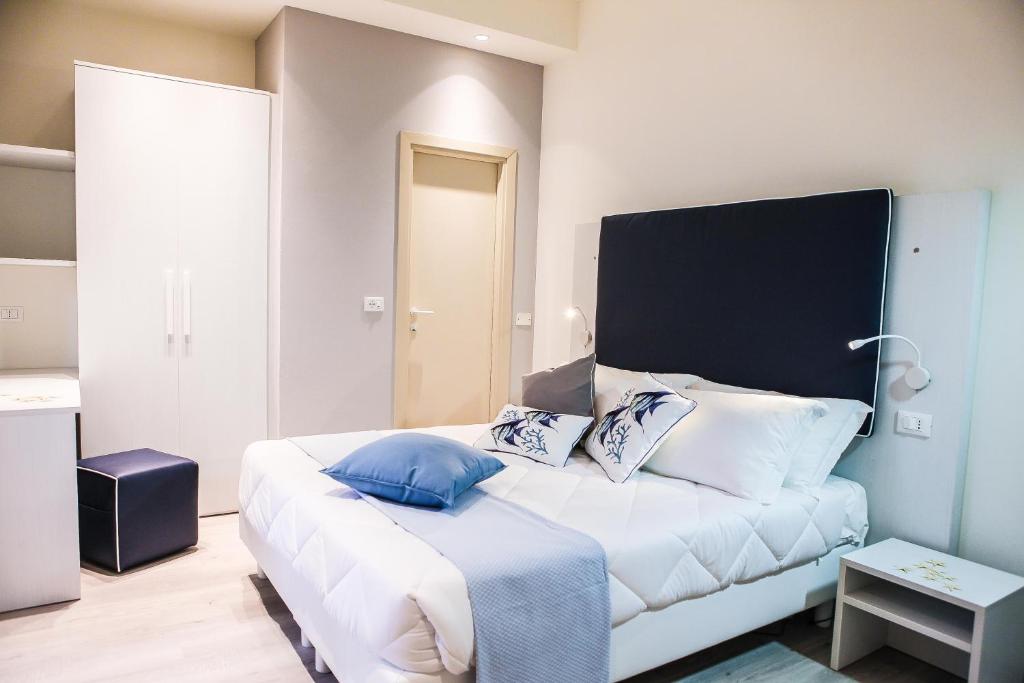 Postel nebo postele na pokoji v ubytování Hotel Veliero