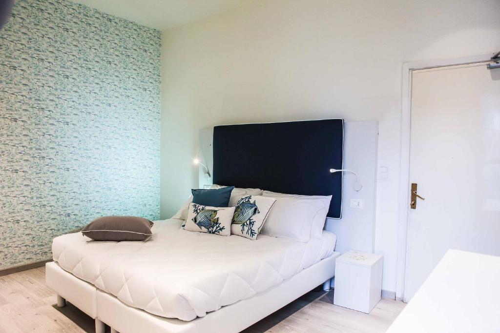 Postel nebo postele na pokoji v ubytování Hotel Veliero