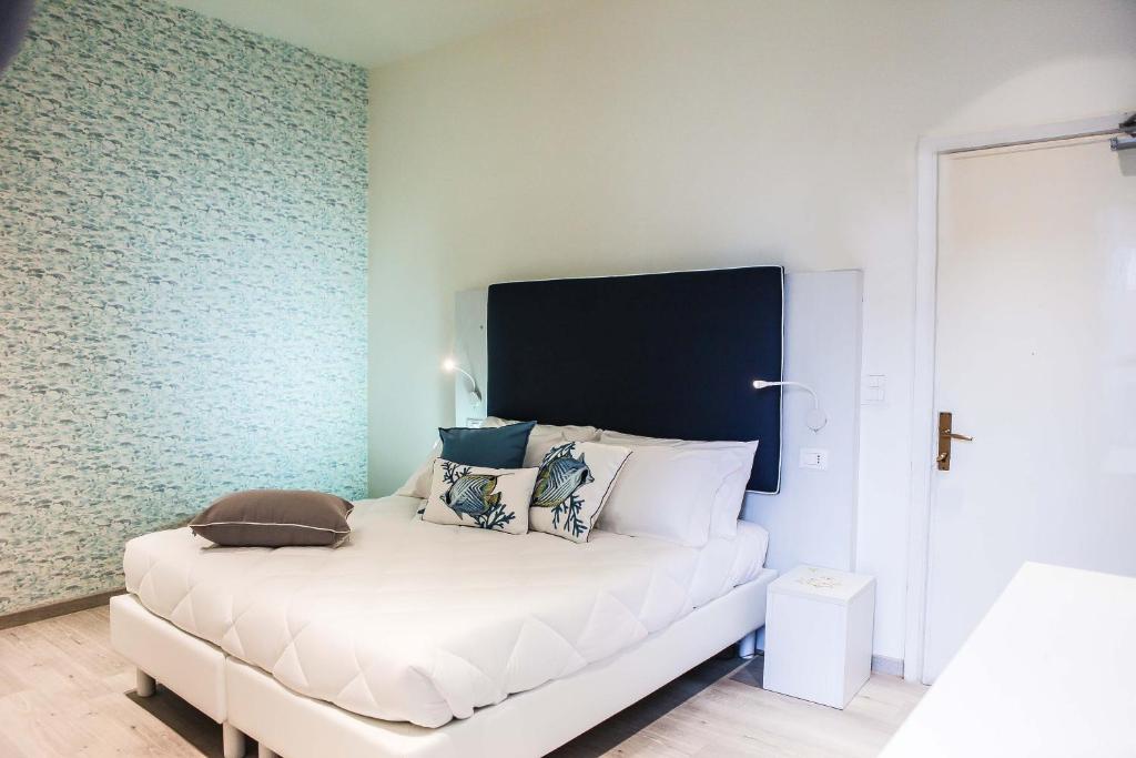 Postel nebo postele na pokoji v ubytování Hotel Veliero