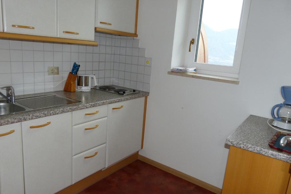 Kuchyň nebo kuchyňský kout v ubytování Garni Sonnleiten