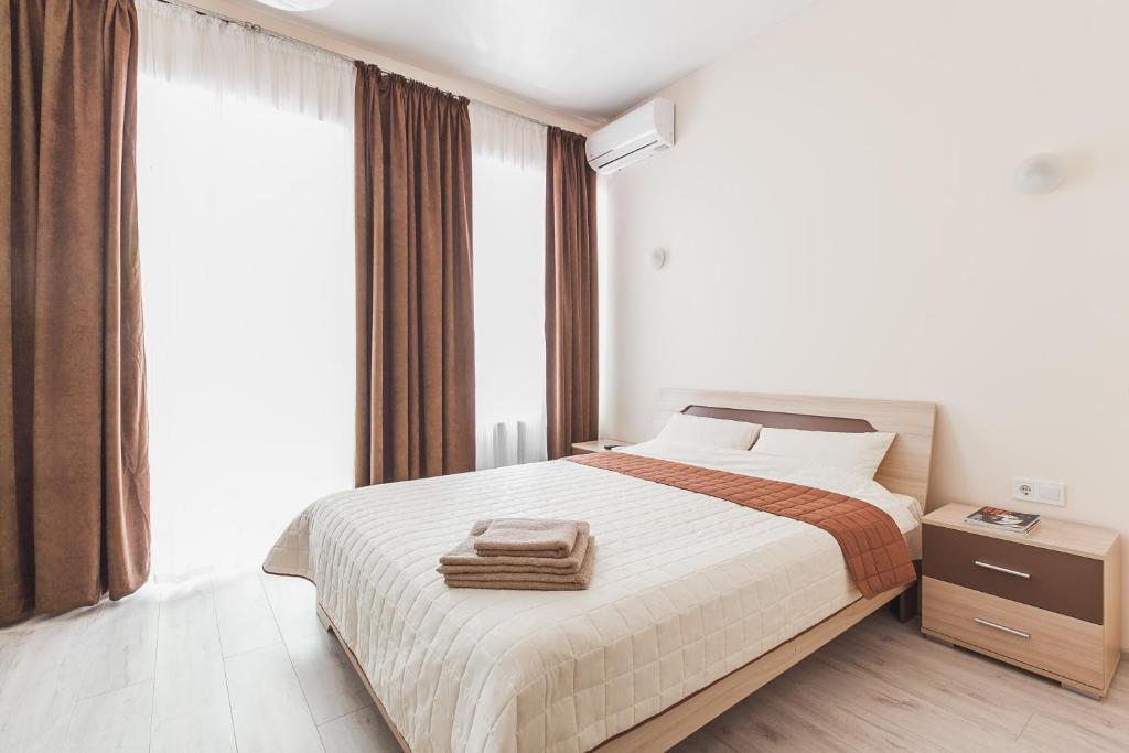 Apartments near Deribasovskaya tesisinde bir odada yatak veya yataklar