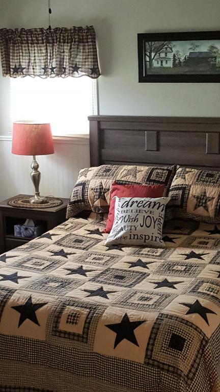 a bedroom with a bed with stars on it at Mama`s By The Sea B&B in Clark's Harbour