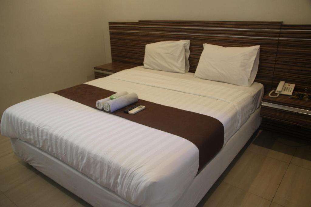 Postel nebo postele na pokoji v ubytování Palapa Hotel