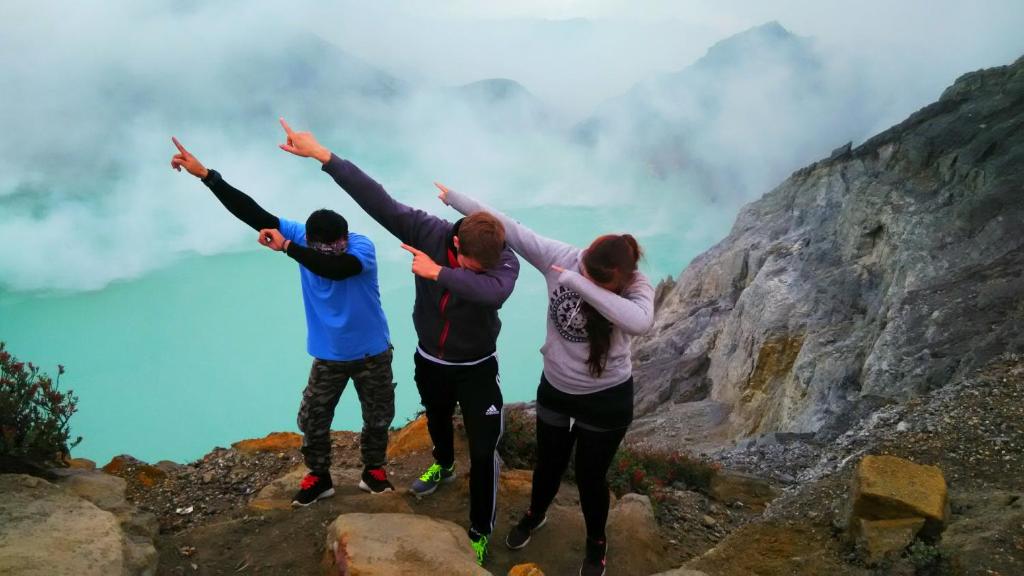 a group of people standing on top of a mountain at Nitha Homestay in Banyuwangi