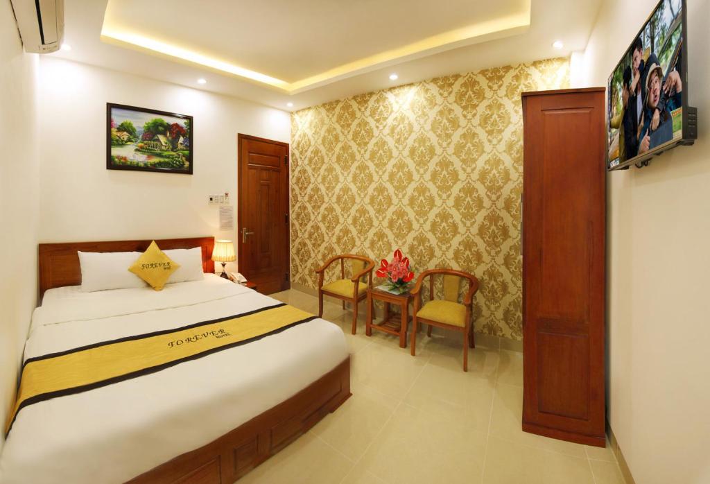 Postel nebo postele na pokoji v ubytování Forever Hotel