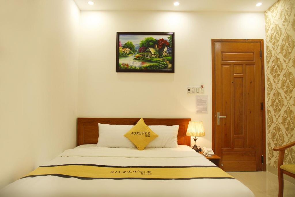 Postel nebo postele na pokoji v ubytování Forever Hotel
