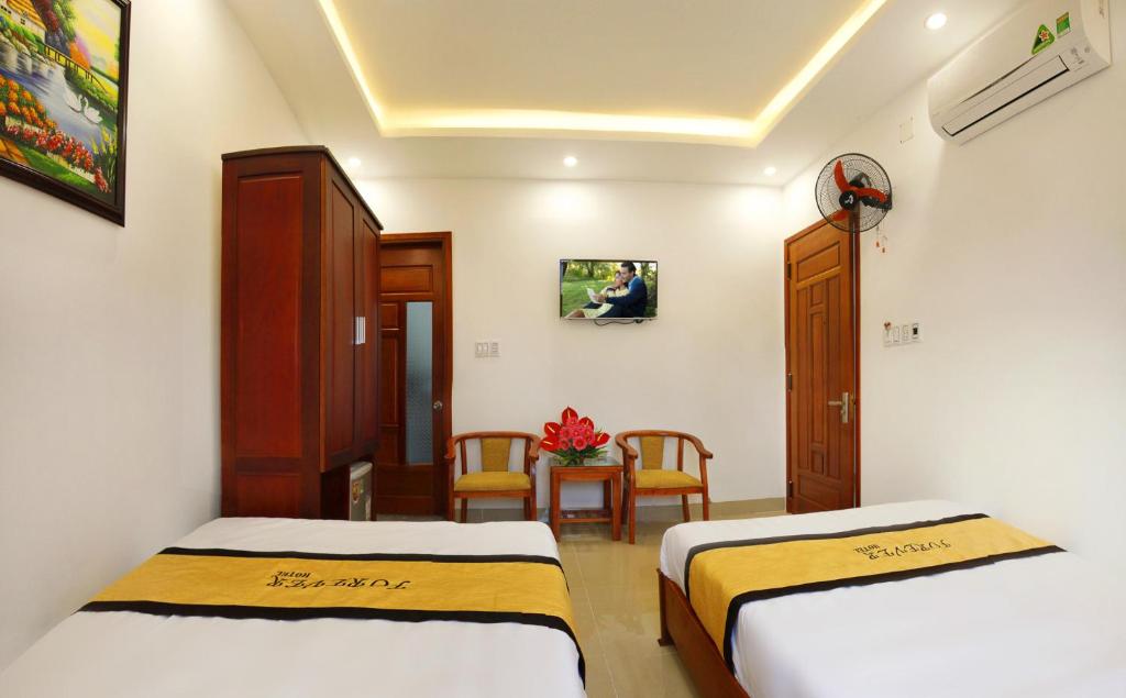 Postel nebo postele na pokoji v ubytování Forever Hotel