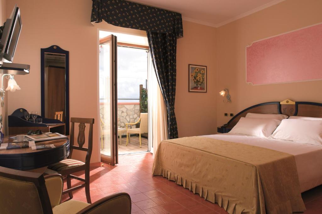 Postel nebo postele na pokoji v ubytování Hotel Prestige