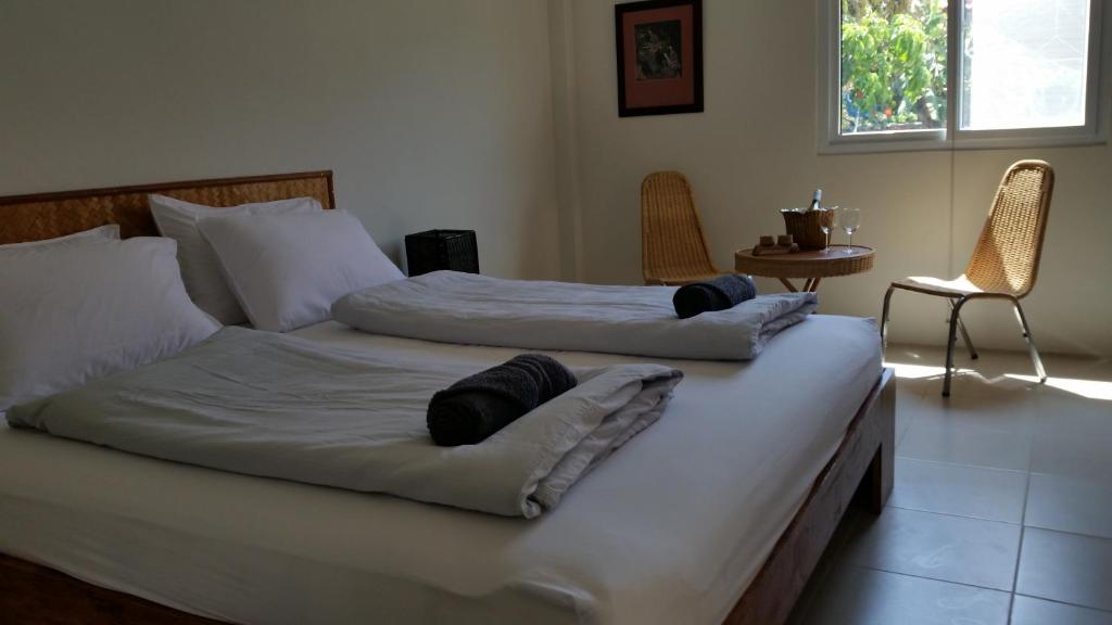 Postel nebo postele na pokoji v ubytování Longan Tree