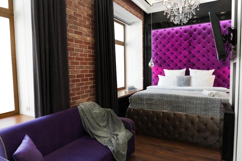 Postel nebo postele na pokoji v ubytování Theatre Boutique Apartments