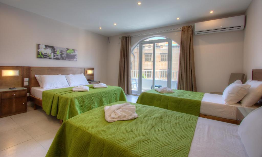 Letto o letti in una camera di Cerviola Hotel
