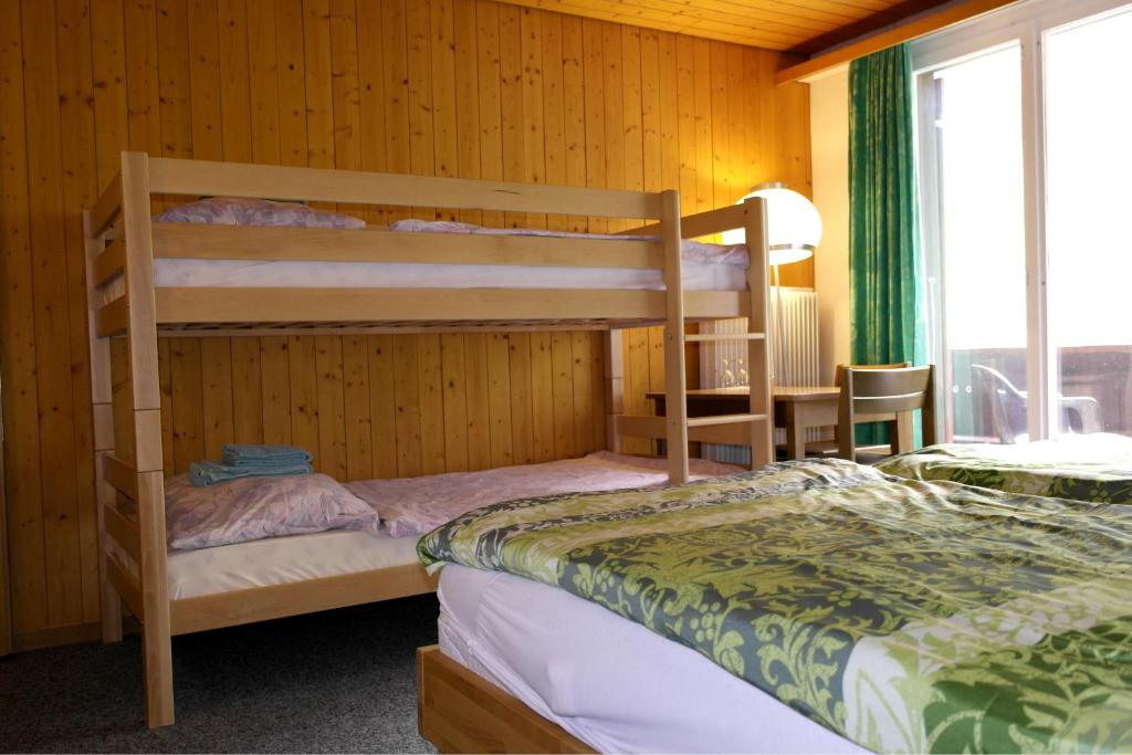 Postel nebo postele na pokoji v ubytování Hotel-Restaurant Stechelberg Bed & Breakfast