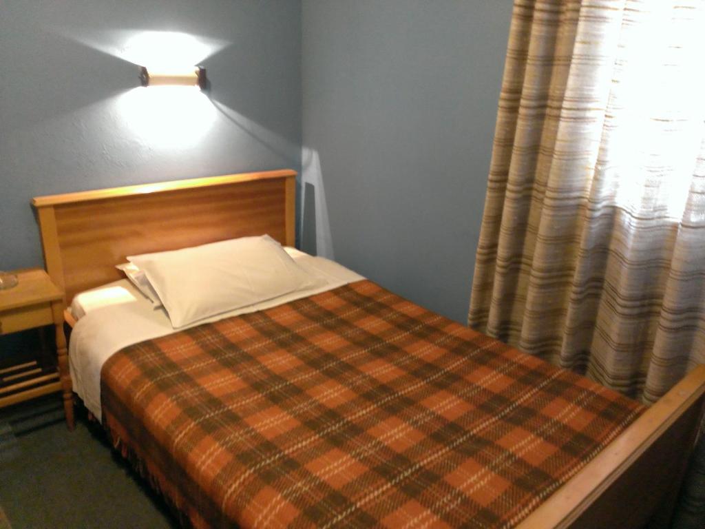 A bed or beds in a room at Artemis