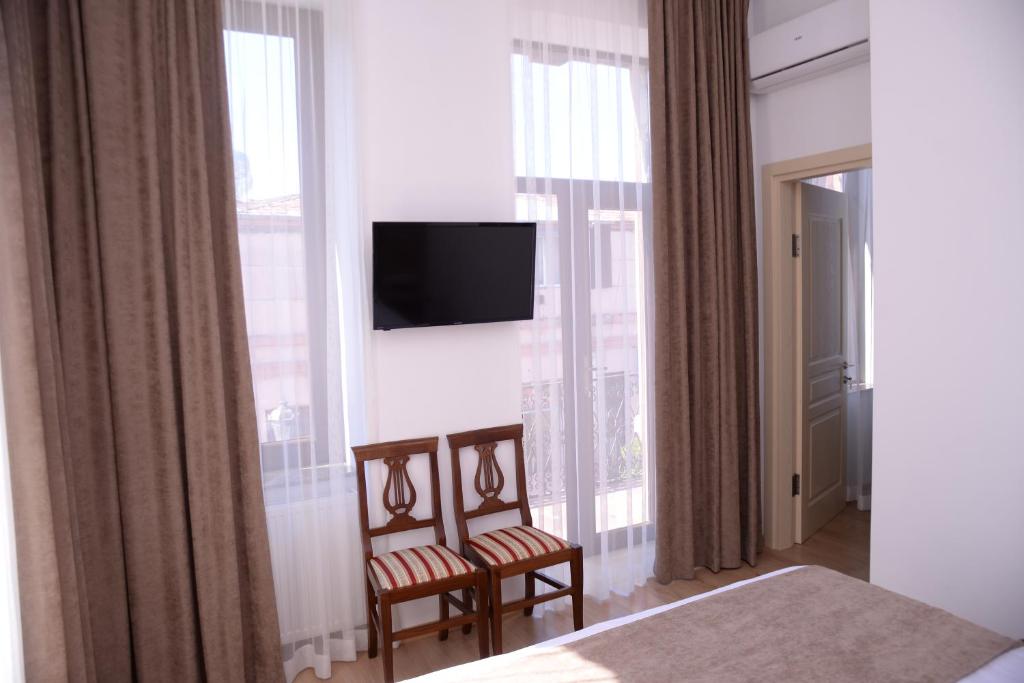 TV a/nebo společenská místnost v ubytování Hotel Varios