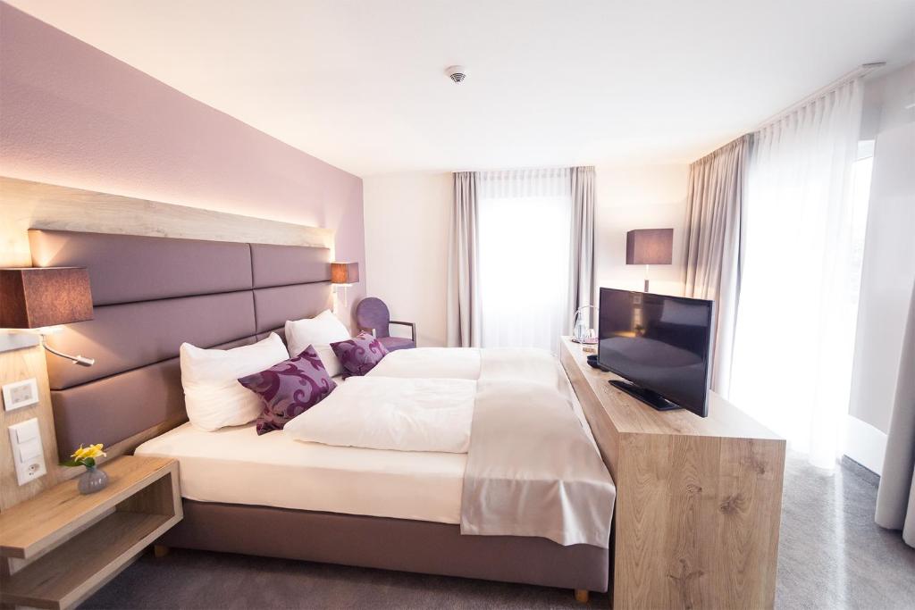 Postel nebo postele na pokoji v ubytování DasSchaffers - MeinWohlfühlhotel