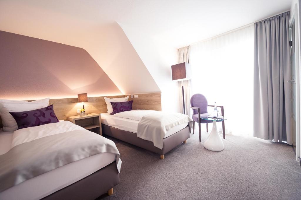 Postel nebo postele na pokoji v ubytování DasSchaffers - MeinWohlfühlhotel