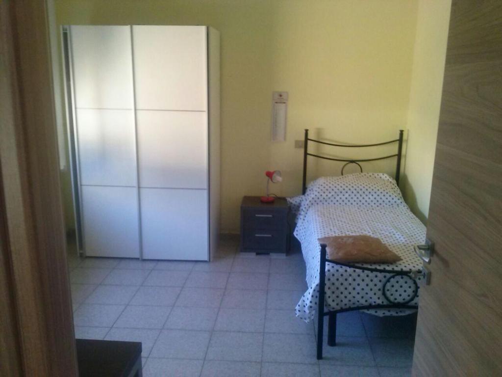 A bed or beds in a room at Appartamento vicino al centro