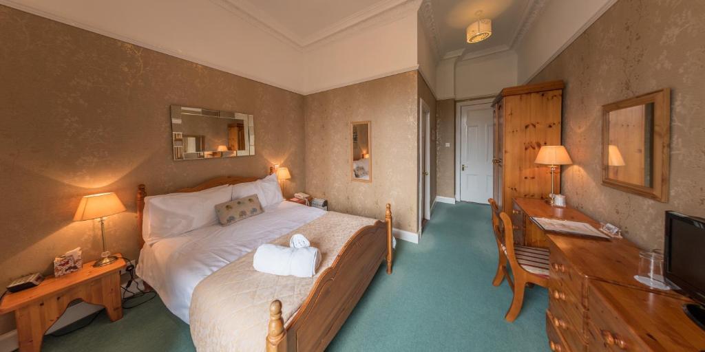 Postel nebo postele na pokoji v ubytování Craigard House Hotel