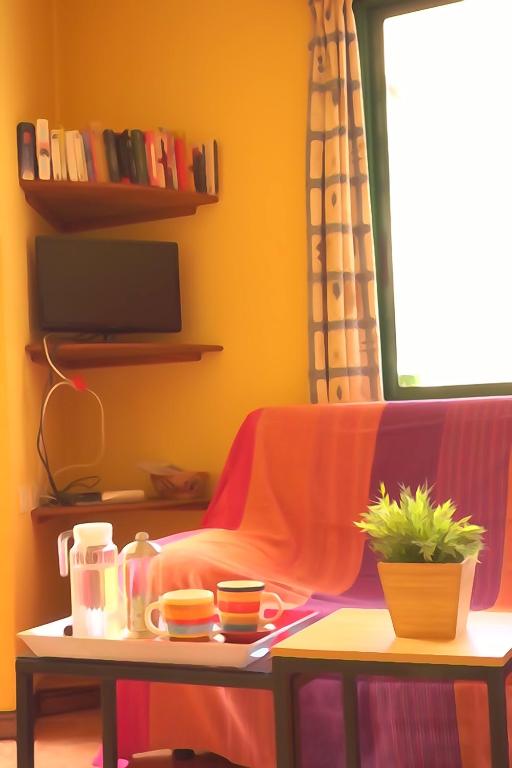 TV a/nebo společenská místnost v ubytování Apartamentos Nayara