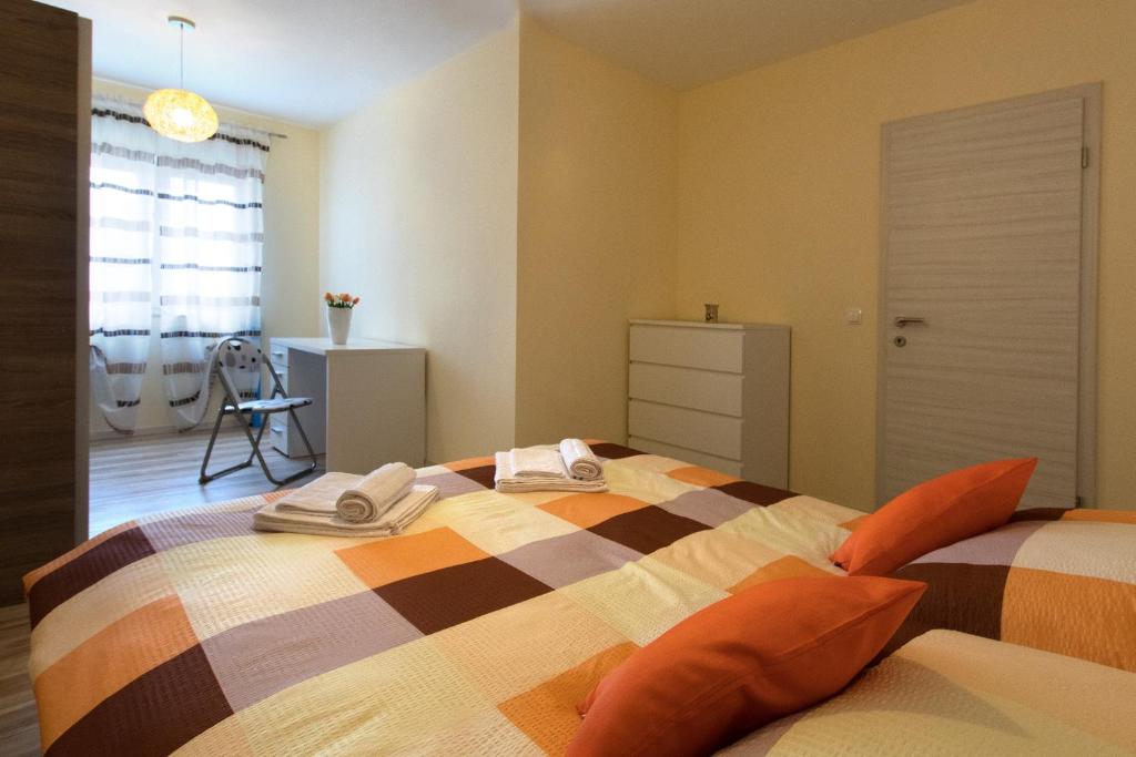 a bedroom with a bed with two pillows on it at Apartment Valmas in Pula