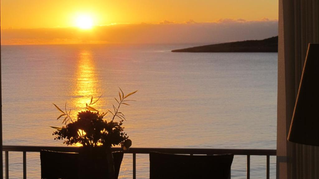 a view of the sunset from the balcony of a condo at Sa Maniga 6 O Apartment Stephanie in Cala Millor