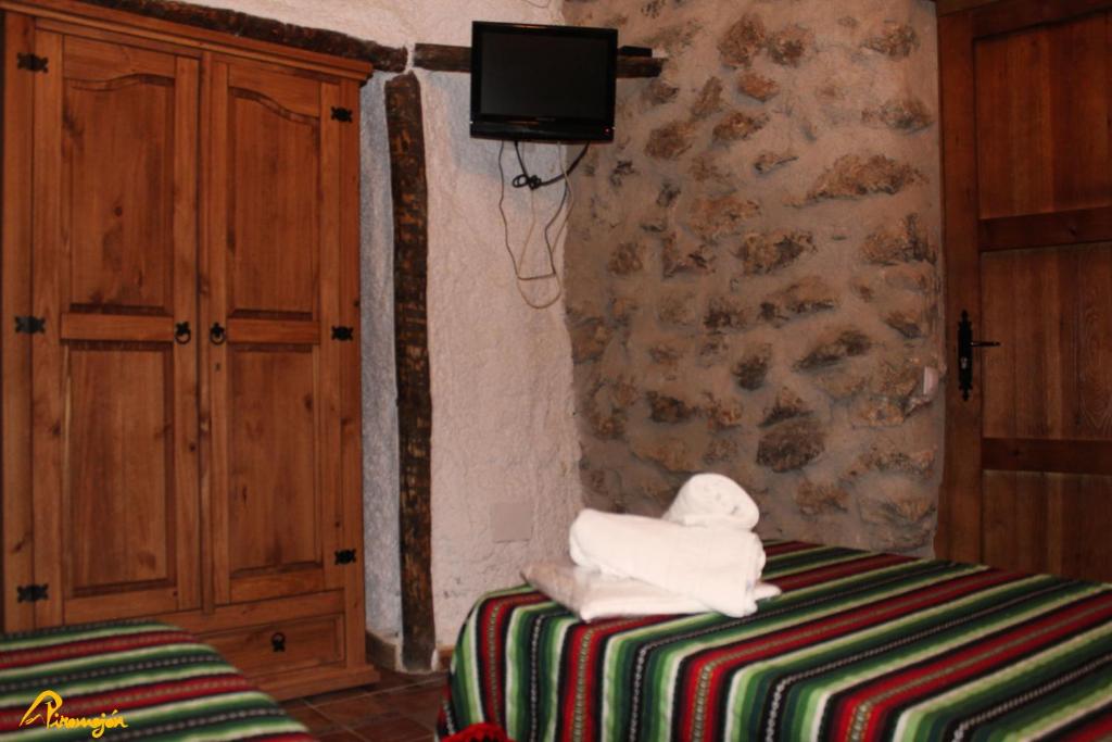 Posteľ alebo postele v izbe v ubytovaní Alojamientos Cuevas Pinomojon