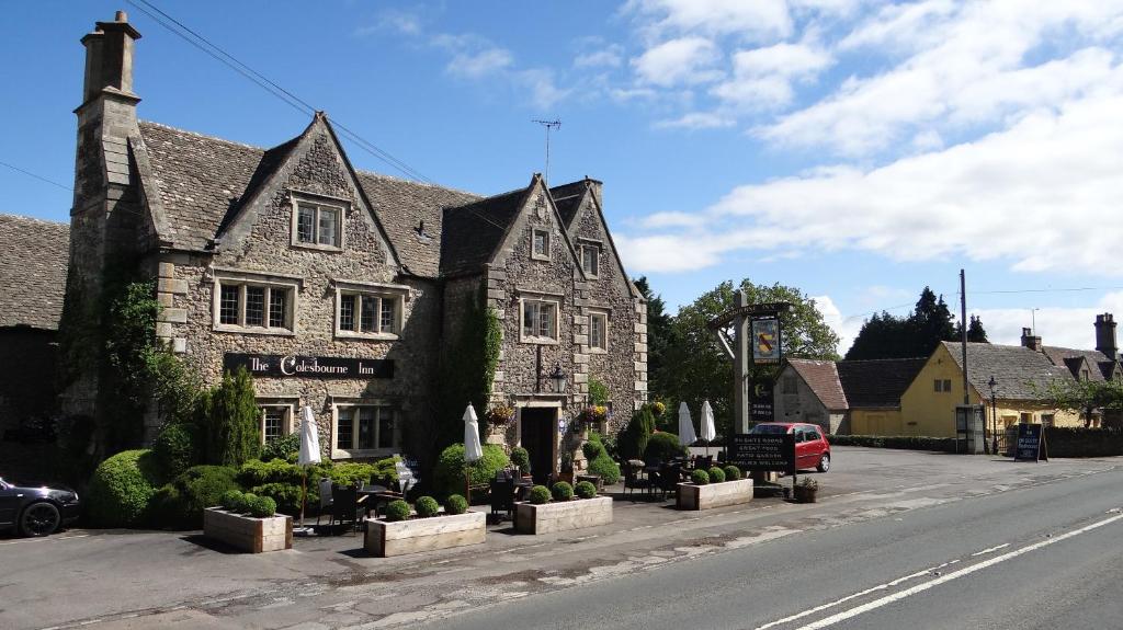 a building on the side of a street at The Colesbourne Inn in Colesbourne