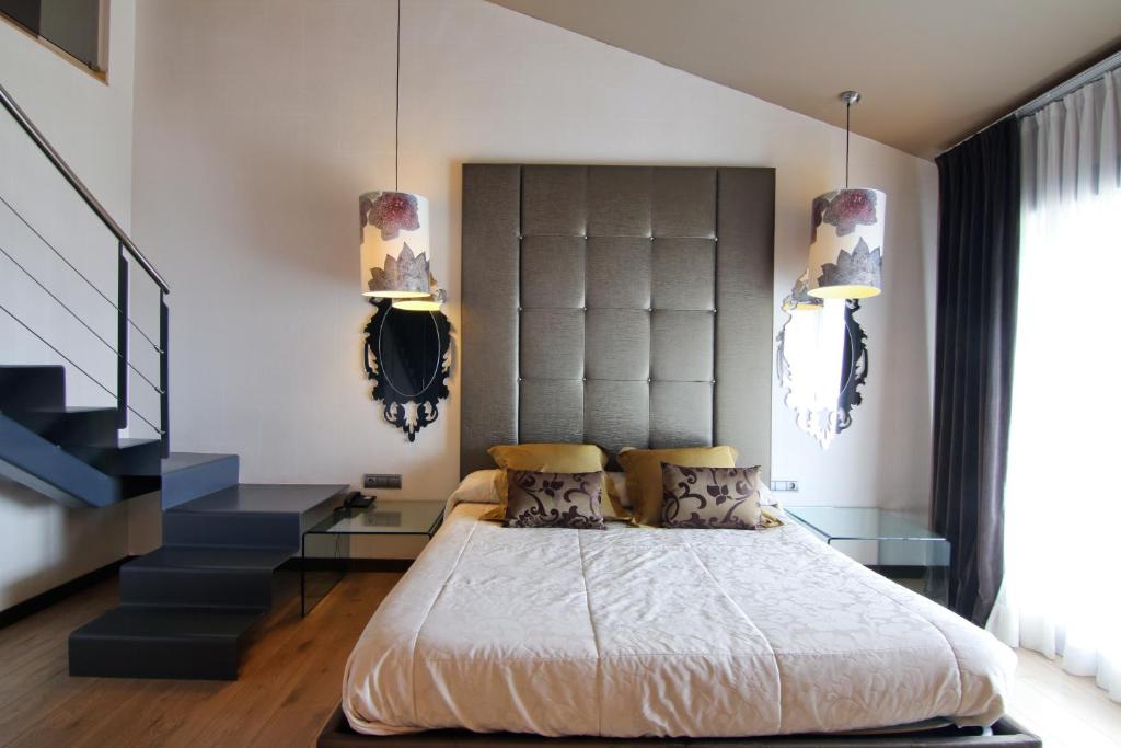 Postel nebo postele na pokoji v ubytování Dolcet L´Hotel