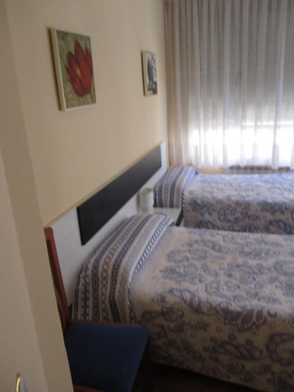 Postel nebo postele na pokoji v ubytování Hostal Becares