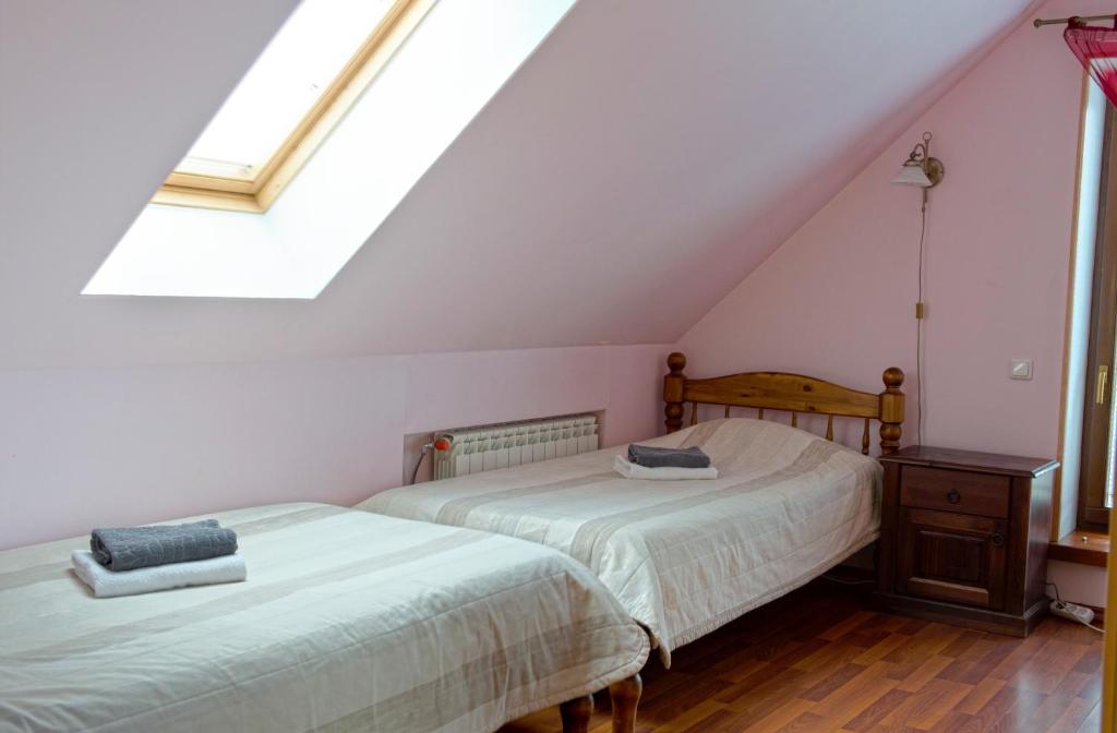Postel nebo postele na pokoji v ubytování Veski Guesthouse