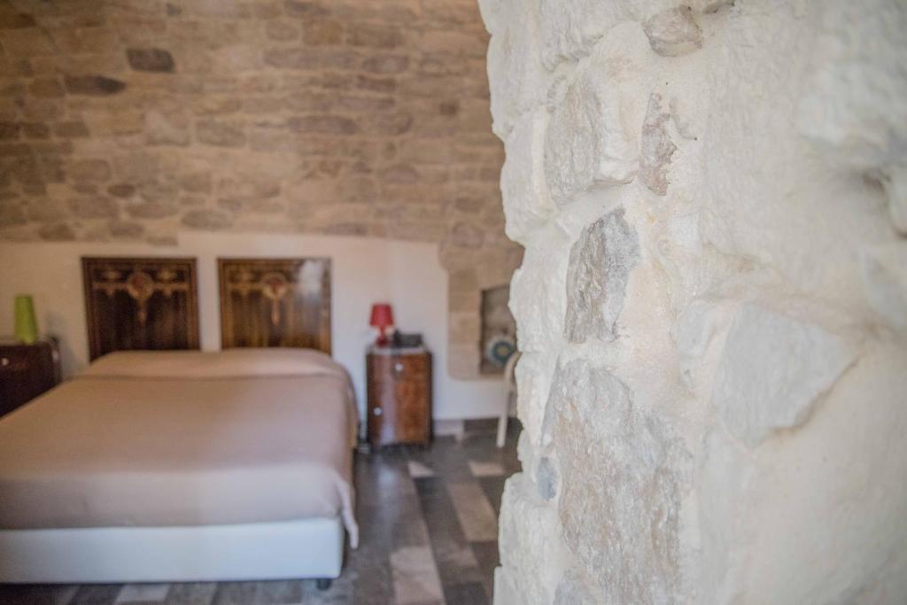Postel nebo postele na pokoji v ubytování Hotel Dell'Orologio