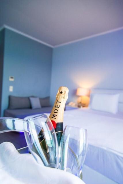 Postel nebo postele na pokoji v ubytování Kymata Hotel