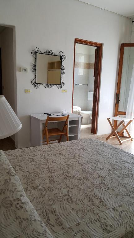 Postel nebo postele na pokoji v ubytování Hotel Marietta