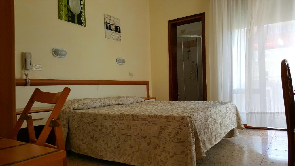 Postel nebo postele na pokoji v ubytování Hotel Marietta