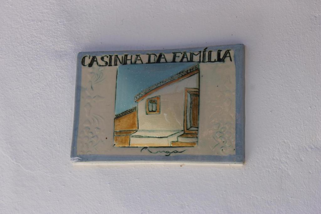 a picture of a painting of a house on a wall at Horta do Zé Miguel in Monchique