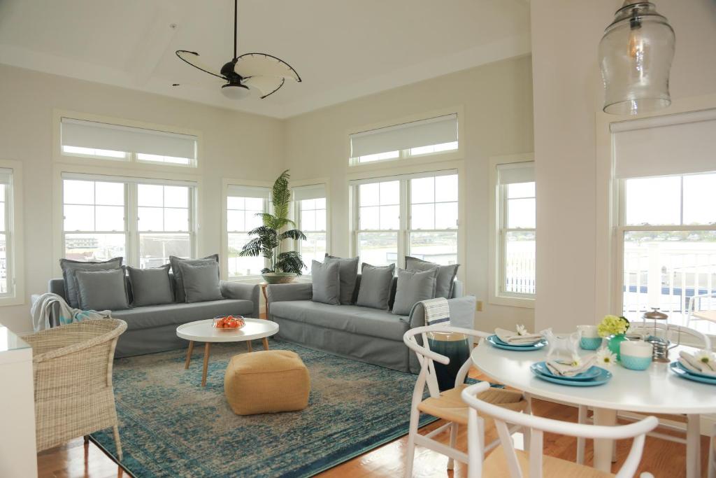 a living room with a couch and a table at The Sea Breeze Inn in Middletown