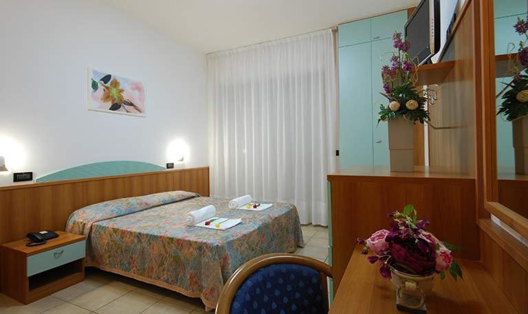 Postel nebo postele na pokoji v ubytování Hotel Sporting