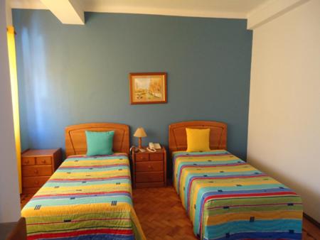Postel nebo postele na pokoji v ubytování Hotel Conforto Latino