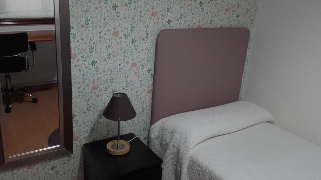 A bed or beds in a room at PR La Paz