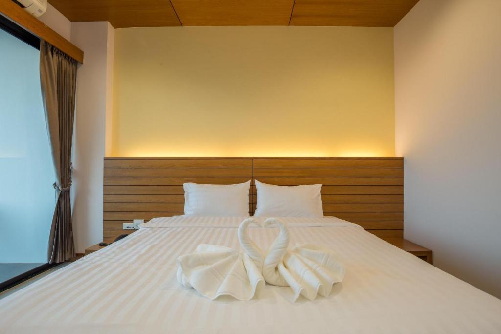 Postel nebo postele na pokoji v ubytování Sann View Hotel