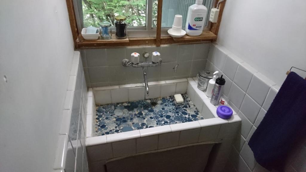 Koupelna v ubytování Guesthouse Okagesan