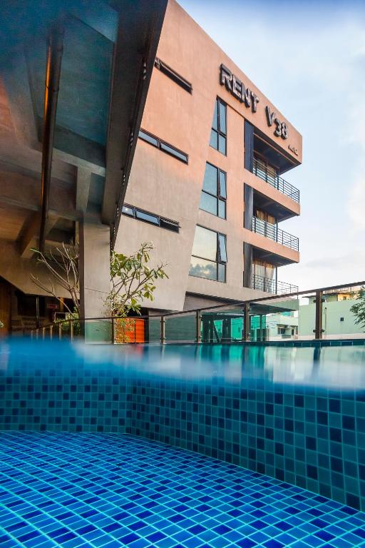 A rooftop-style pool photographed alongside the hotel facade.