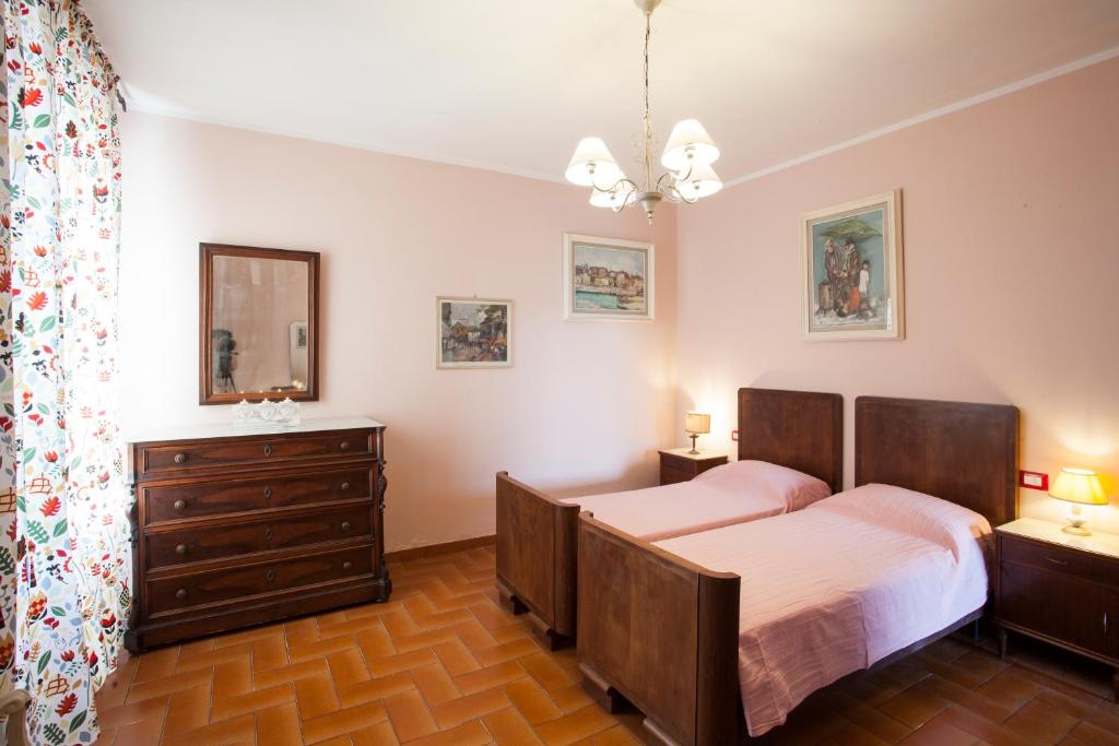 Postel nebo postele na pokoji v ubytování Podere La Capacciola