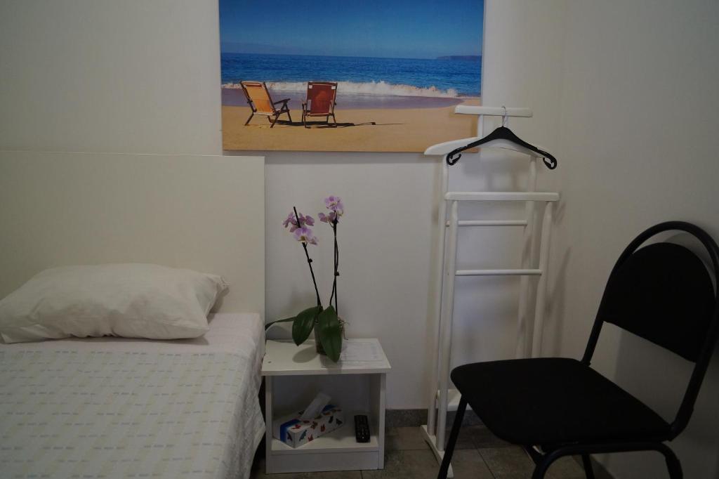 Postel nebo postele na pokoji v ubytování SkyHome Mini-hotel