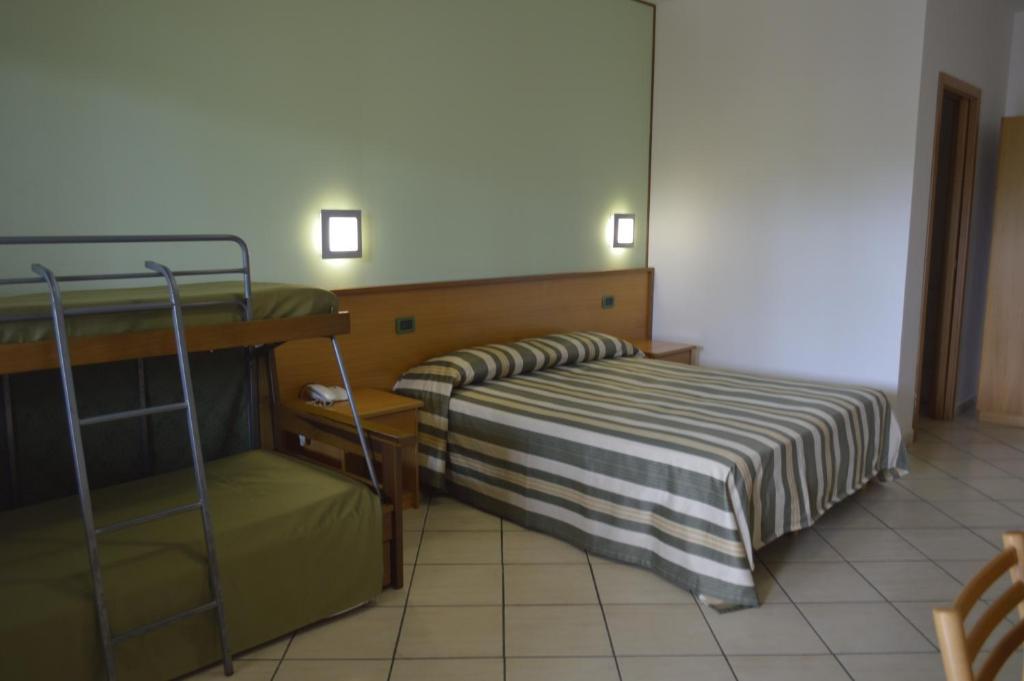 Postel nebo postele na pokoji v ubytování Hotel Zilema