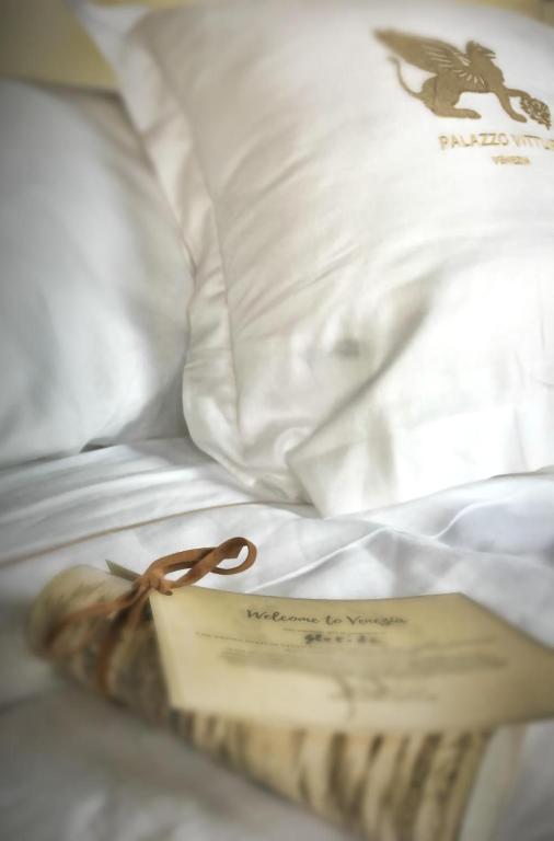 Postel nebo postele na pokoji v ubytování Hotel Palazzo Vitturi