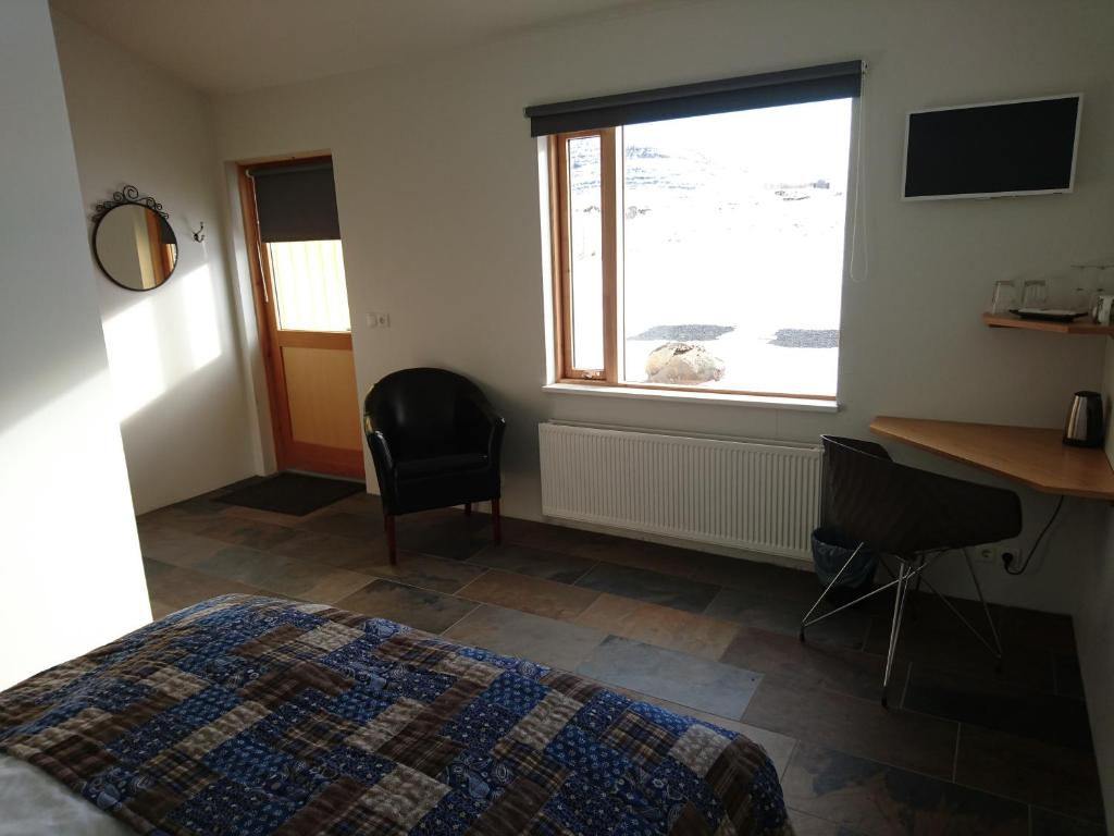 Postel nebo postele na pokoji v ubytování Fossatún Country Hotel