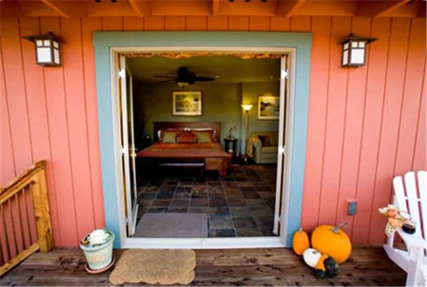 a front door of a house with a bed in it at Pearlessence Vineyard Inn in Sebastopol